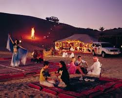 tourists enjoying Bedouin camp experiences while in an emirates desert safari dubai