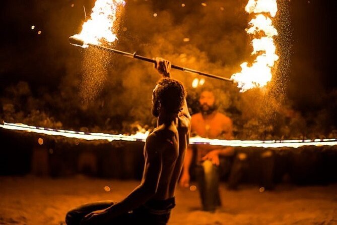 tourists enjoying fire show in evening safari dubai