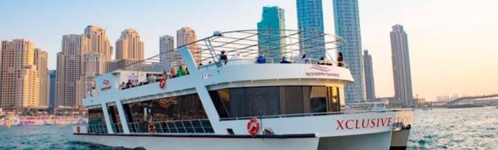 Guests enjoying gourmet dining on the deck of Marina Dhow in Dubai.