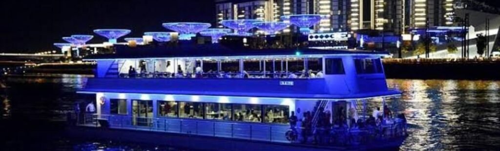 Guests relaxing on the upper deck of Marina Dhow in Dubai