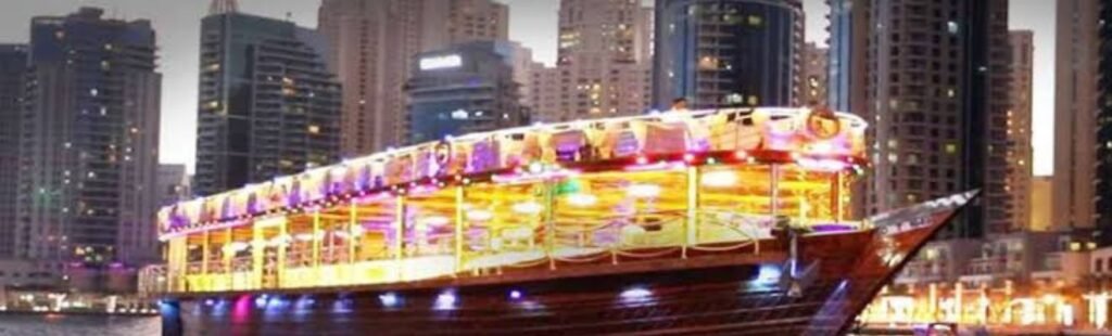 The Dubai Marina skyline seen from Marina Dhow at dusk.