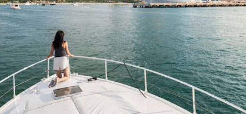 Luxurious Marina Dhow cruise boat sailing on Dubai's waterfront .