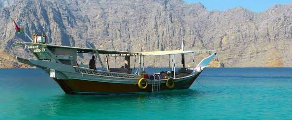 Guests enjoying Arabic coffee on a dhow boat in Dubai.