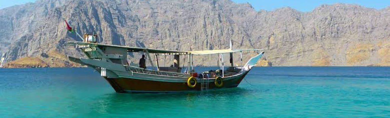 Guests enjoying Arabic coffee on a dhow boat in Dubai.