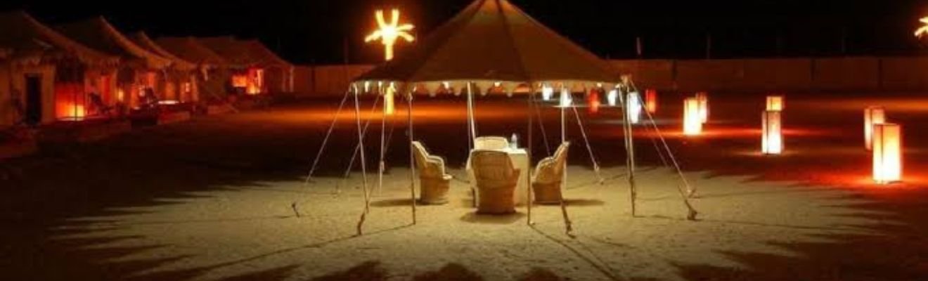 Guests enjoying a traditional Arabic dinner at a desert camp in Dubai.