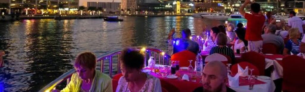 Romantic couple enjoying a Marina Dhow Dinner Cruise in Dubai.