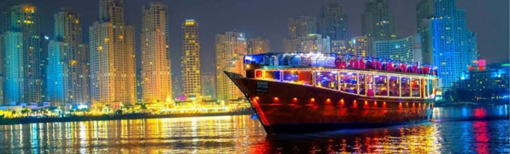 Night view of a Dhow River Cruise illuminated in Dubai.