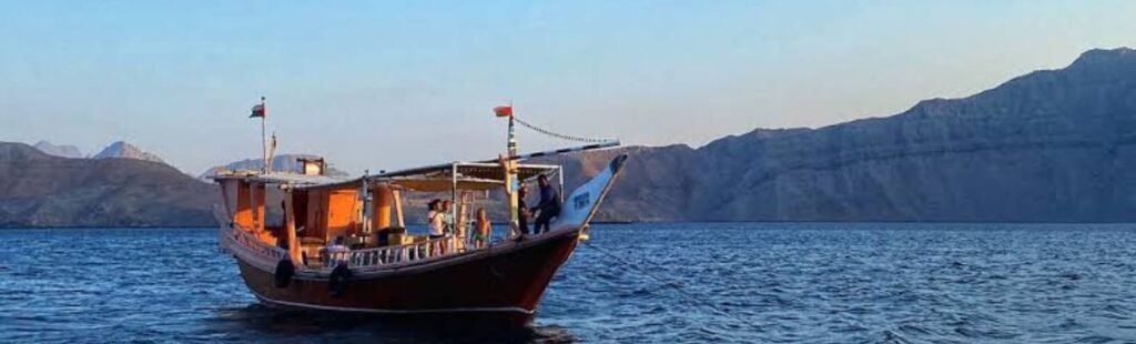 Guests admiring Dubai's skyline from a Dhow River Cruise.