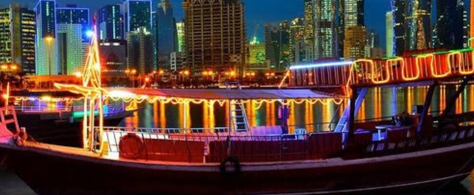 Dhow Marina Cruise sailing in Dubai at sunset.