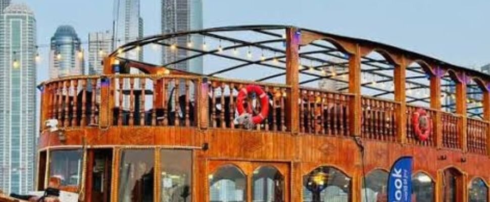 Dhow Cruise Marina with guests dining at sunset.