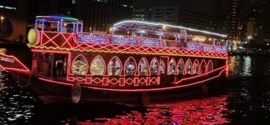 Marina Dhow Cruise sailing against Dubai's skyline.