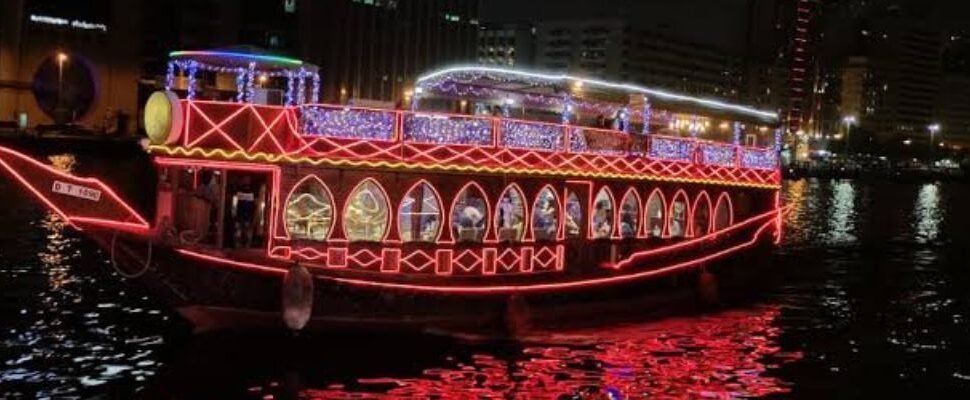 Marina Dhow Cruise sailing against Dubai's skyline.