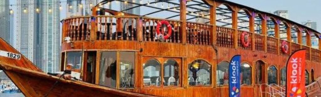 Guests admiring Dubai skyline from Dhow Cruise.