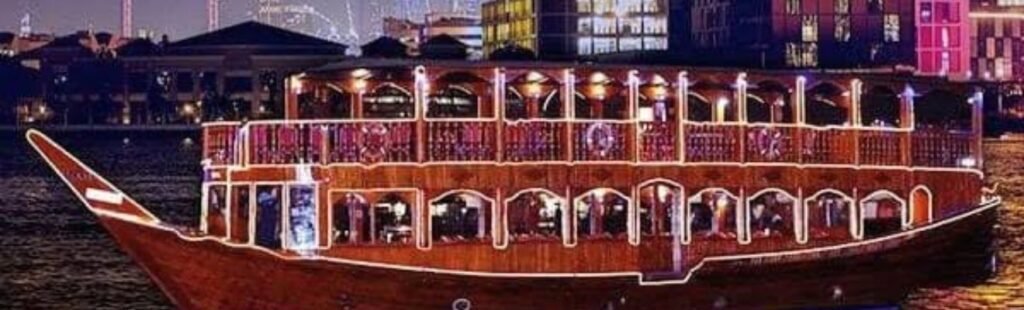 Night view of a Dhow Cruise illuminated in Dubai.