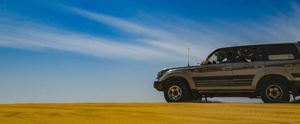 Desert Safari vehicle sand bashing in Dubai's desert.