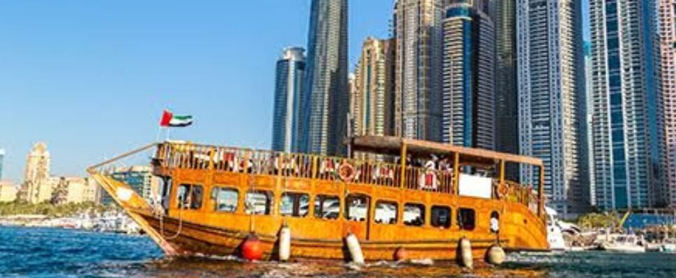 Dhow Cruise Dinner with Dubai skyline in the background.