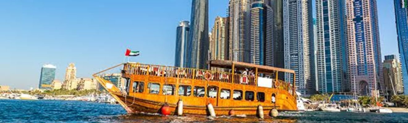 Dhow Cruise Dinner with Dubai skyline in the background.