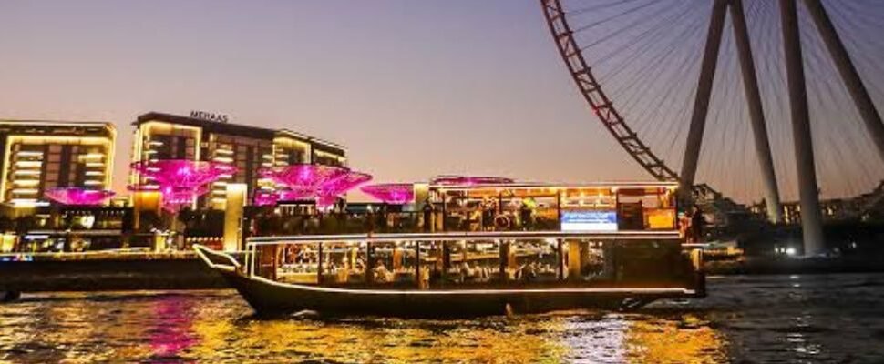 Luxurious Dhow Cruise Marina sailing at sunset.