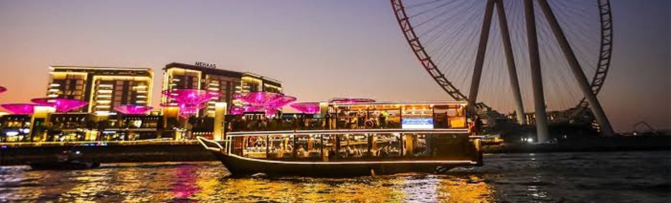 Luxurious Dhow Cruise Marina sailing at sunset.