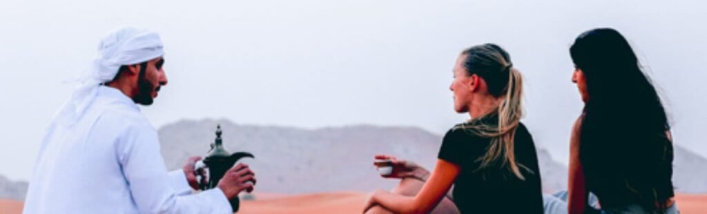 Guests enjoying a BBQ dinner in the Dubai desert.