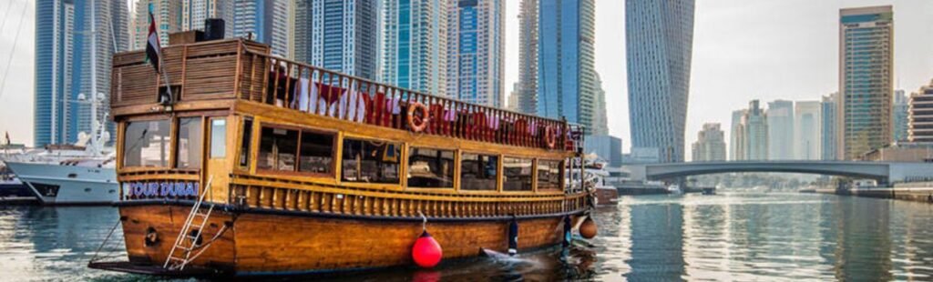 Guests admiring Dubai's skyline from a Marina Dhow Cruise.