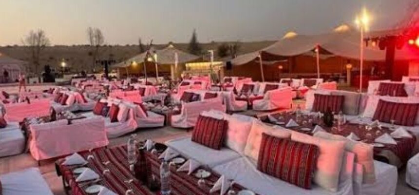 Dubai Desert Excursion vehicle driving through desert dunes.
