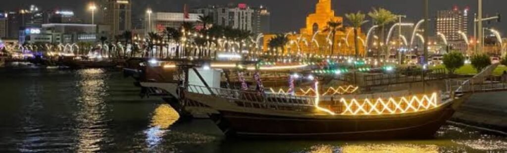 Night view of a Dhow boat illuminated in Dubai.