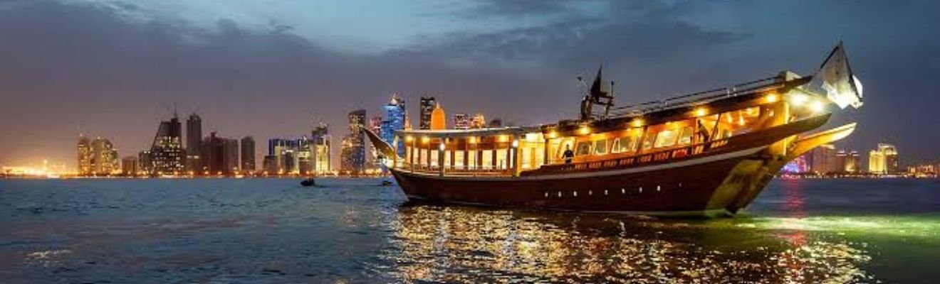 Luxurious boat cruising through Dubai Marina at sunset.