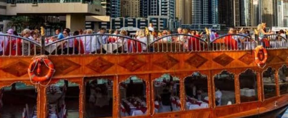 Luxurious Lunch Cruise boat sailing on Dubai's waterfront.