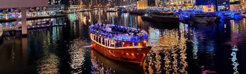 Guests admiring the Dubai Creek skyline from a Dhow Cruise.