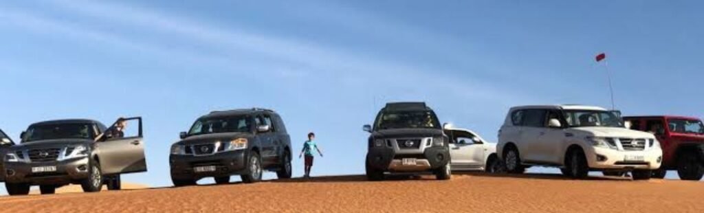 Guests enjoying a BBQ dinner in the Dubai desert.