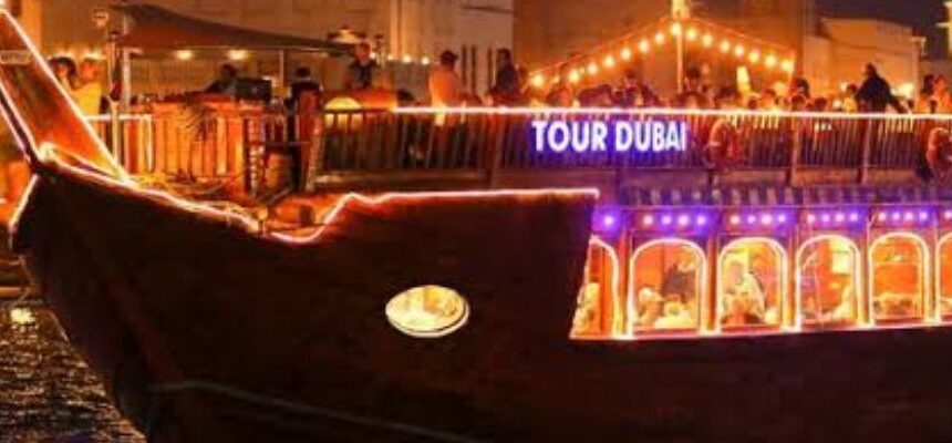 Arabian Dhow Cruise › Forever Tourism LLC Arabian Dhow Cruise sailing with Dubai's skyline in the background.
