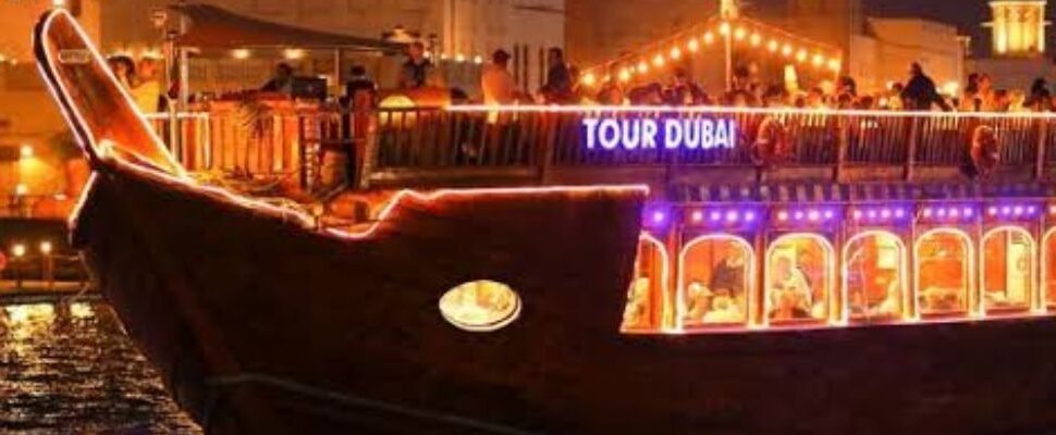 Arabian Dhow Cruise sailing with Dubai's skyline in the background.