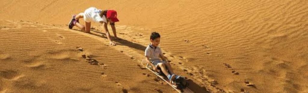 Guests enjoying a BBQ dinner in the Dubai Desert.