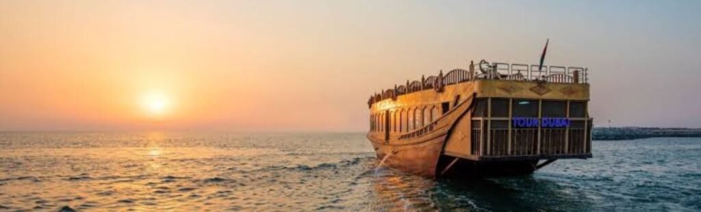 Guests taking photos on a Sunset Dhow Cruise in Dubai.