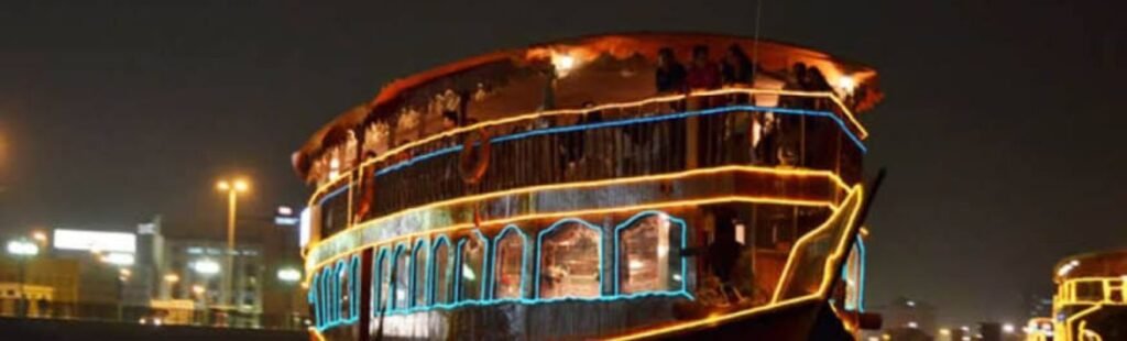 Guests dining on a Sunset Dhow Cruise in Dubai.