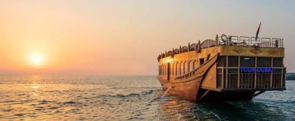 Marina Dhow Cruise with Dubai skyline at night.