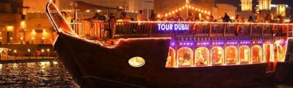 Night view of a Dhow Cruise illuminated in Dubai.