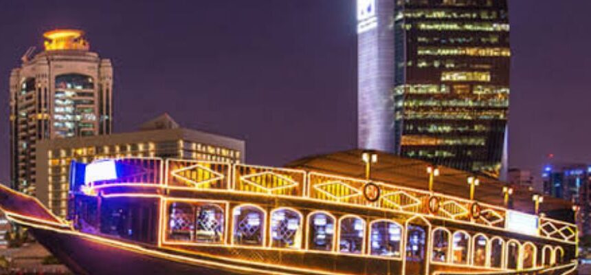 Dhow Cruise Marina Groupon: › Forever Tourism LLC Dhow Cruise Marina illuminated at night with Dubai skyline.