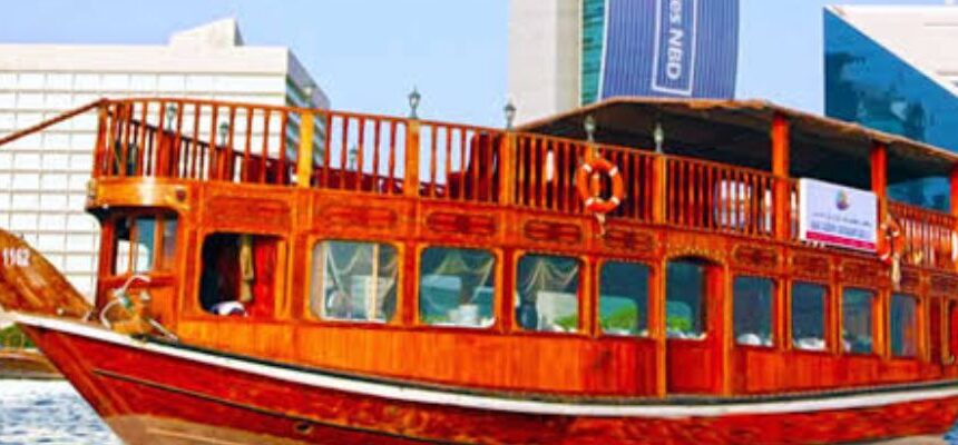 Gourmet dining setup on a Dhow Cruise with Dubai skyline.