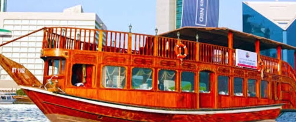 Gourmet dining setup on a Dhow Cruise with Dubai skyline.