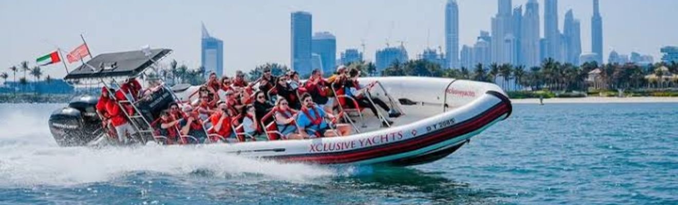 Marina boat sailing with Dubai skyline in the background.