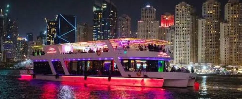 Marina Dinner Cruise yacht sailing in Dubai at dusk.