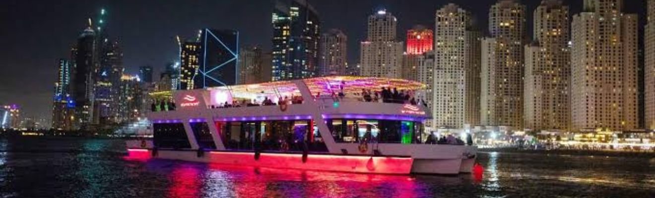 Marina Dinner Cruise yacht sailing in Dubai at dusk.