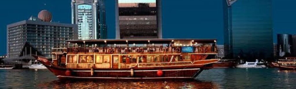 Guests admiring Dubai's skyline from a Marina cruise ship.