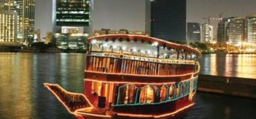 Dhow Cruise Creek Offers › Forever Tourism LLC Dhow Cruise sailing on Dubai Creek at sunset.