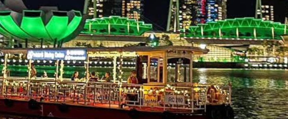 A luxurious dhow cruising Dubai Marina at night.