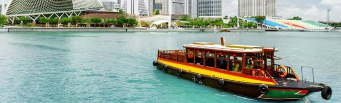 A Marina boat gliding through Dubai Marina with skyscrapers in the background.