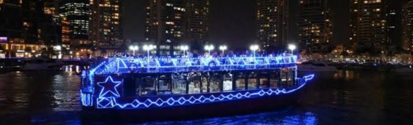 Traditional dhow boat cruising through Dubai Marina