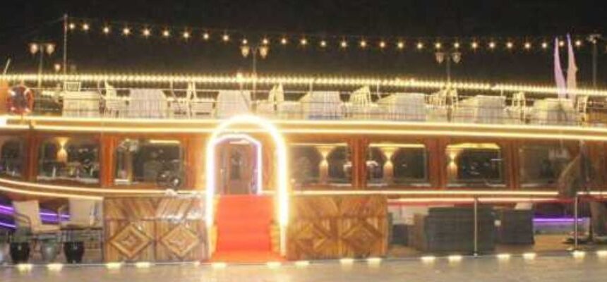 Luxury Marina Cruise › Forever Tourism LLC Luxurious yacht cruising through Dubai Marina at sunset.